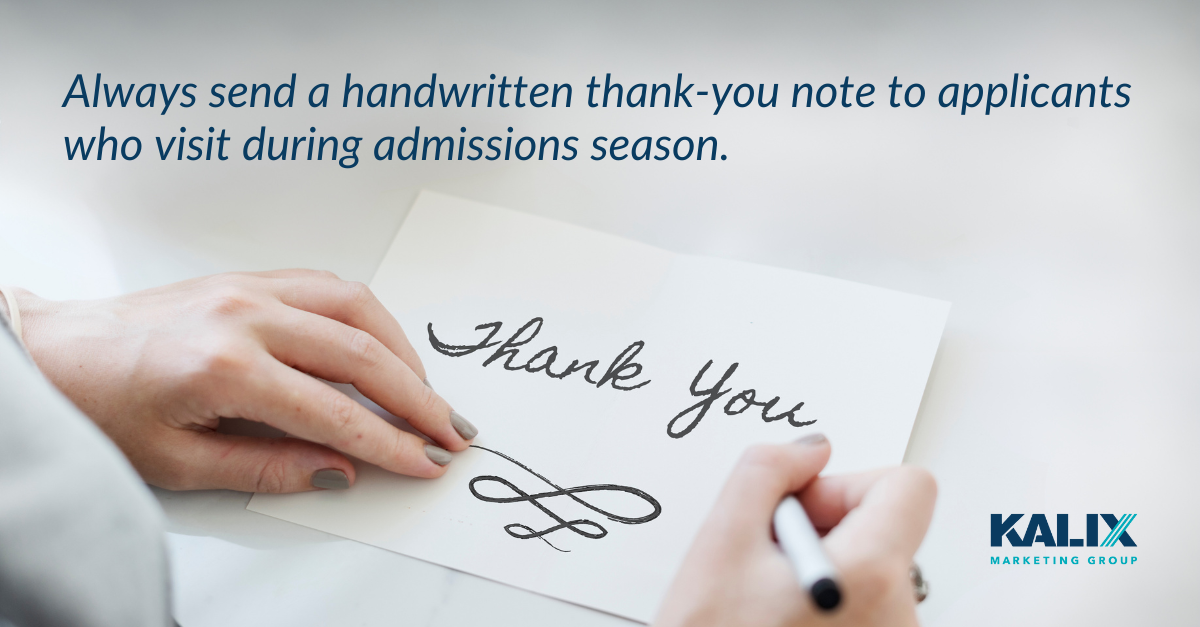 Photo of a hand writing a thank you note.