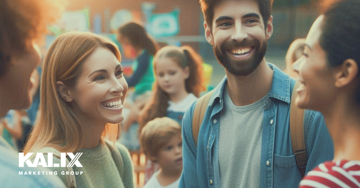 Parents engaging with one another at a school event with there children playing in the background